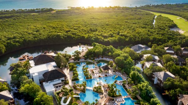 fairmont mayakoba pools and buildings integrate with natural canals, ocean and rainforest