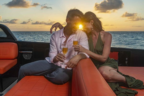 couple in a luxury yacht sunset