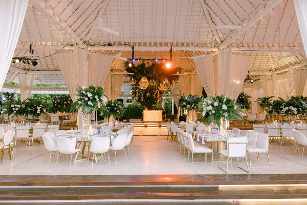 open-air wedding reception with tropical flowers