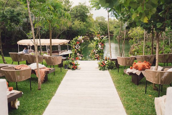 private boat awaits at the end of a path at wedding