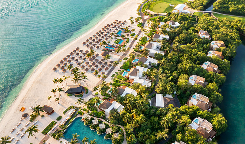 fairmont mayakoba beach club with lounges and ocean pools