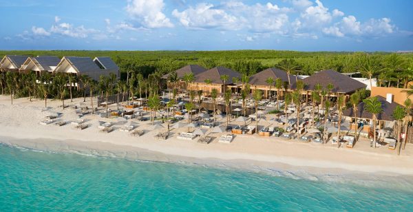 beach clubs lines pristine ocean waters at banyan tree mayakoba