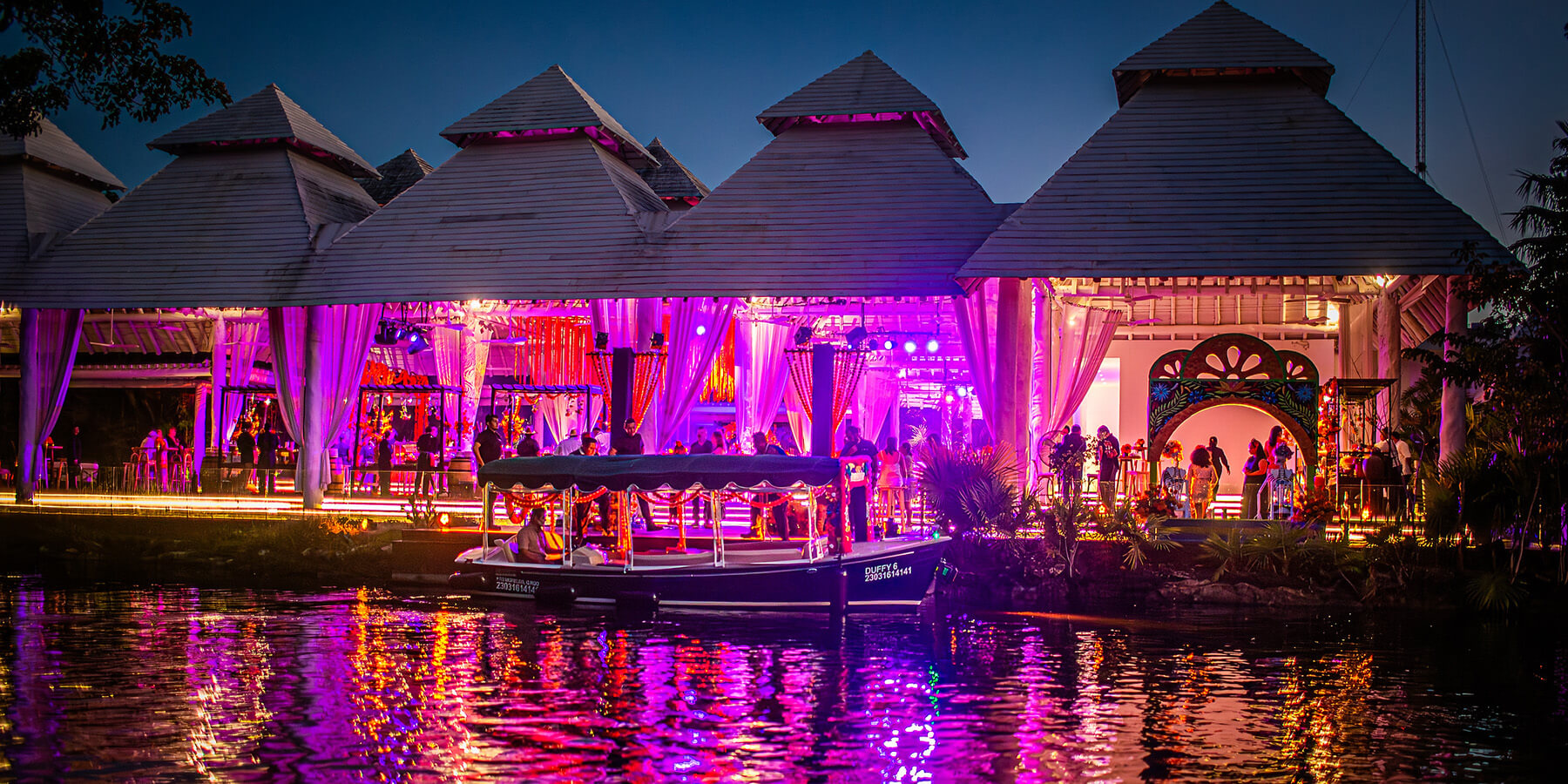 boat arrives to colorful event venue at mayakoba