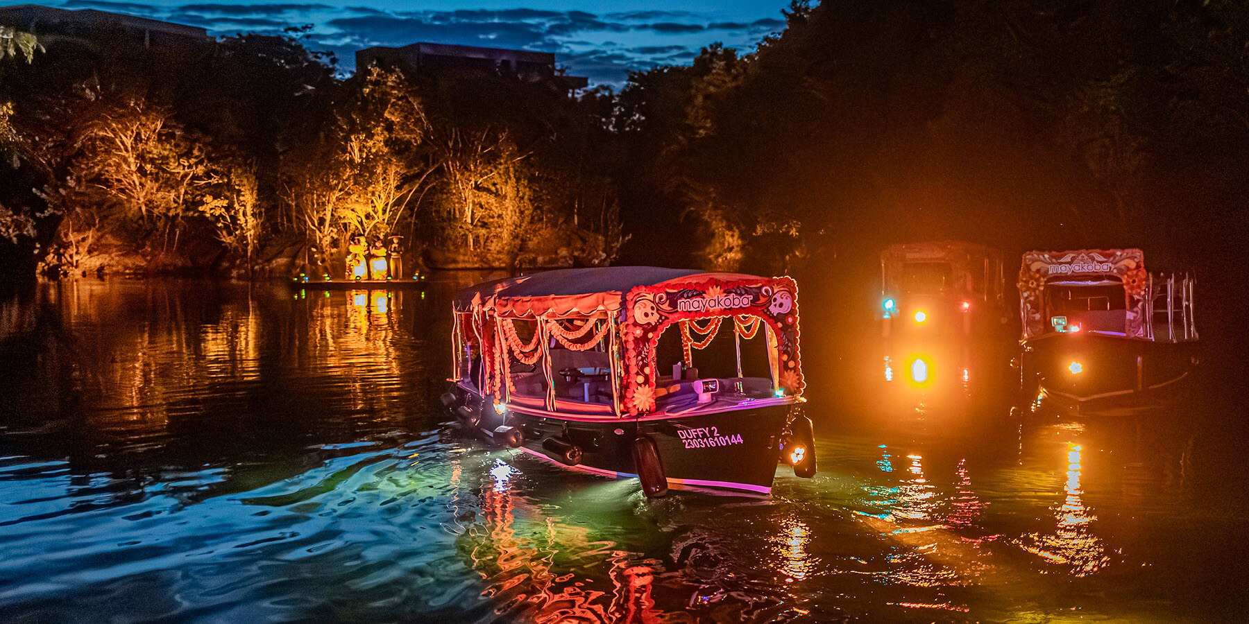boat cruises through colorful mexican holiday event at mayakoba